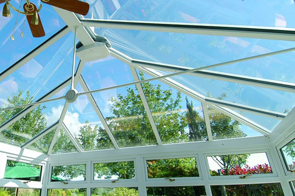 The view out of the glass roof of a conservatory.