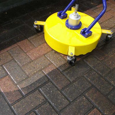 A driveway being professionally cleaned.