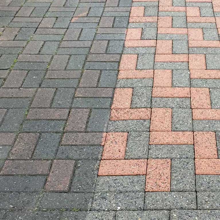 A comparison of paving stones before/after professional cleaning.