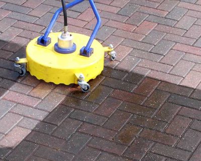 A driveway being professionally cleaned.