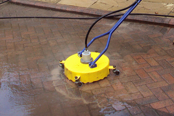 A driveway being professionally cleaned.