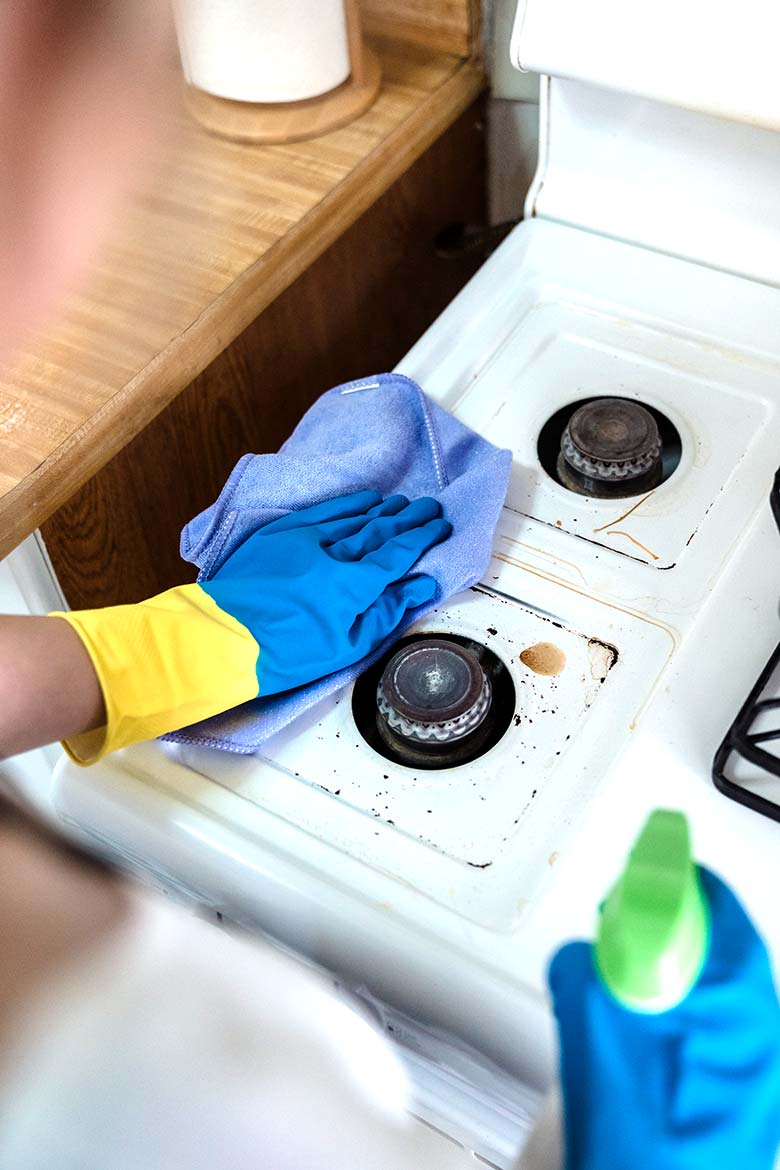 A stove being cleaned.