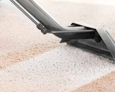 A carpet being professionally cleaned.